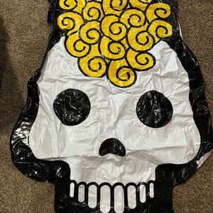 Inflatable Skull Pool Floatie with Yellow Accents